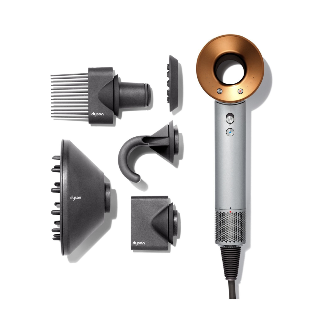 Dyson Supersonic hair dryer with magnetic styling attachments including diffuser, comb, and smoothing nozzle