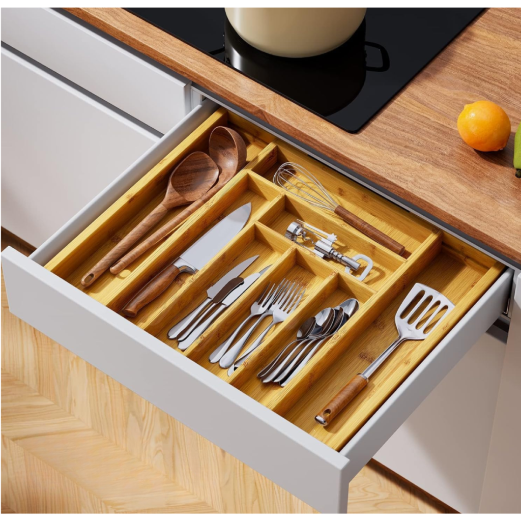 bamboo silverware drawer organizer organizing utensils inside a kitchen drawer