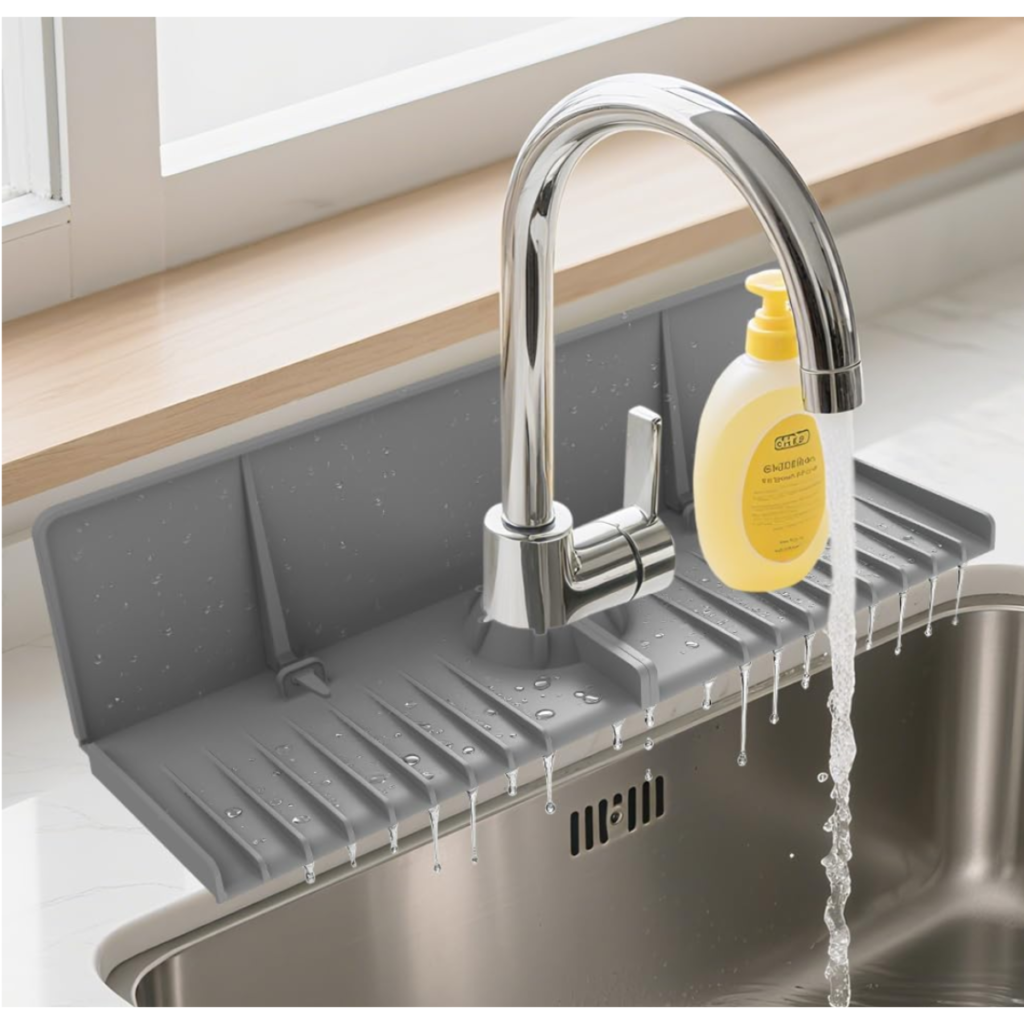 silicone faucet drip protector mat installed around kitchen sink faucet to catch water and keep countertops dry